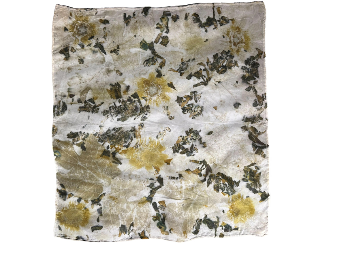 A square piece of fabric with a distressed, tie-dye-like pattern featuring olive green, mustard yellow, and off-white tones, laid flat against a white background.
