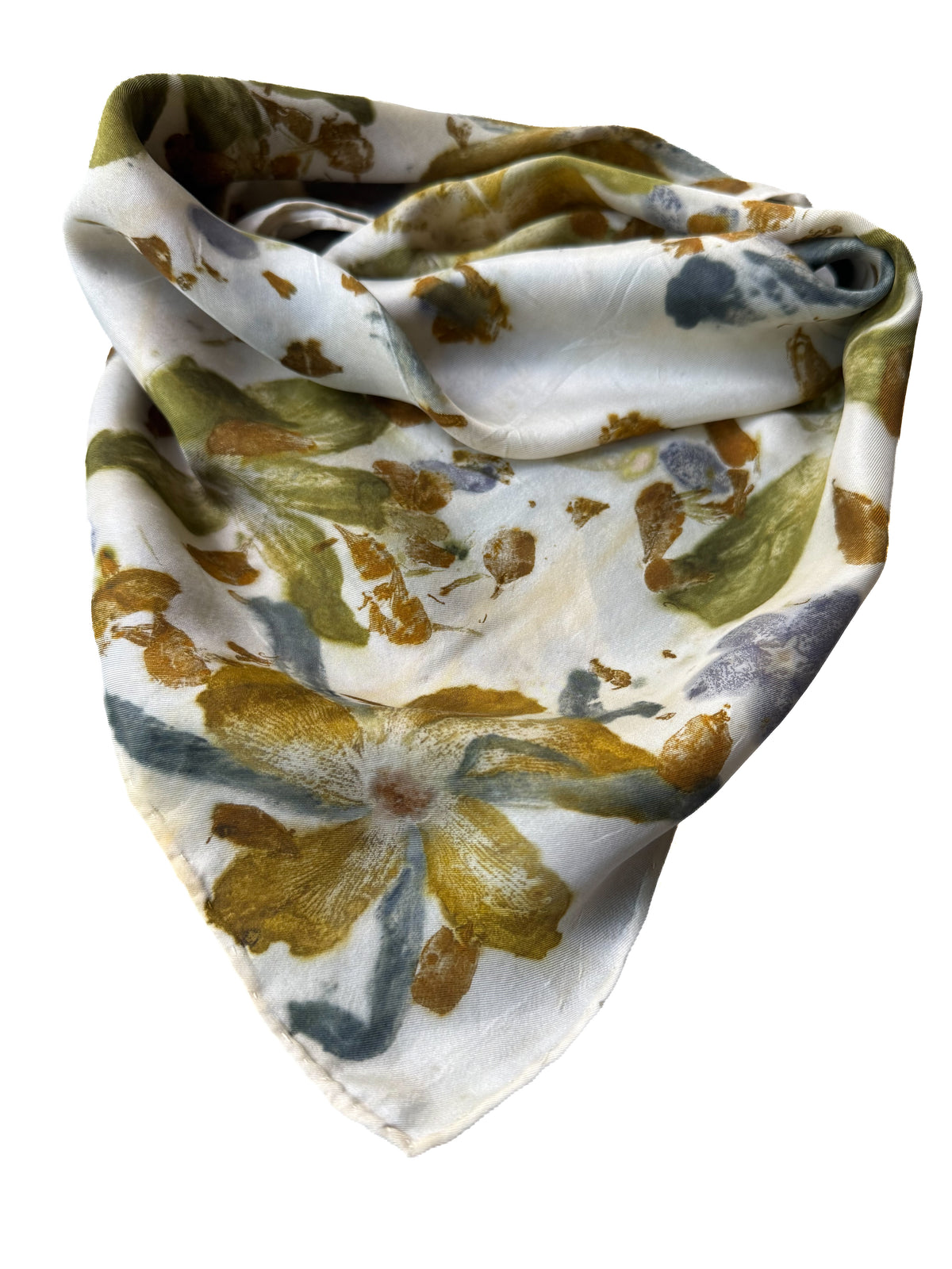A lightweight triangular scarf with a watercolor floral pattern in olive green, mustard yellow, and slate blue on a white background, shown against a plain white studio backdrop.