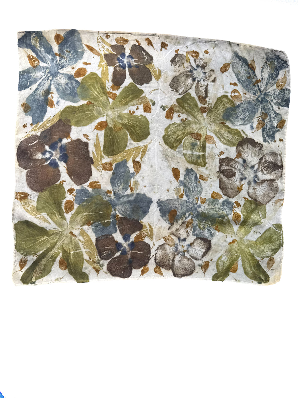 A square fabric scarf or bandana featuring a vintage floral block-print pattern on a cream background with blue, green, brown, and gold tones.